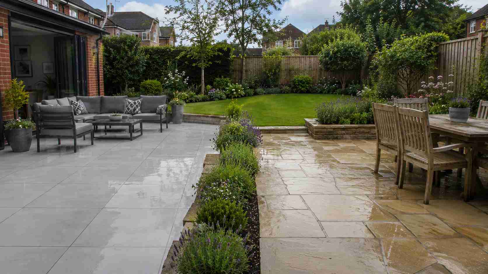 A beautifully landscaped garden with lawn, patio and planted borders in Surrey