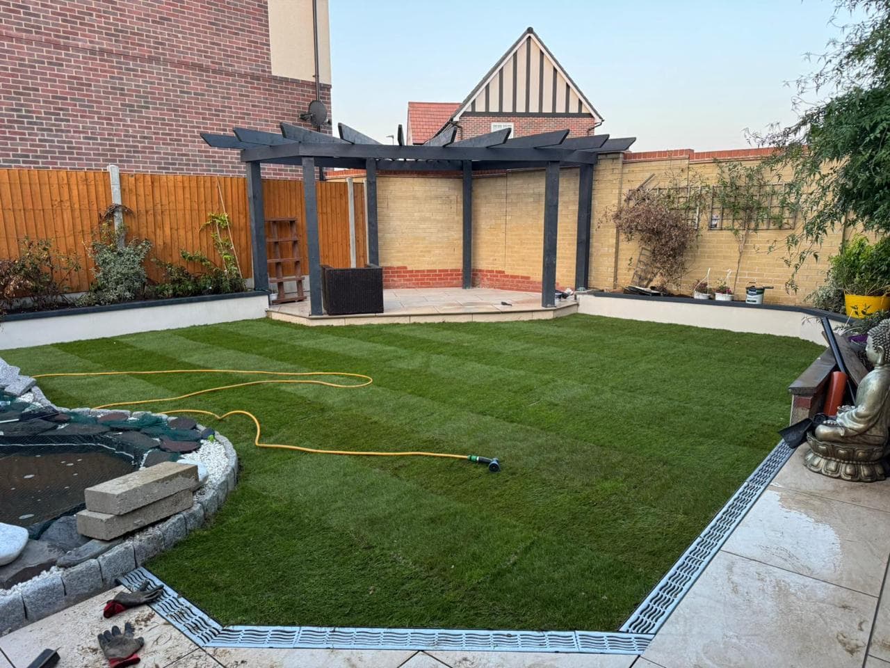 The garden after renovation with restored lawn and borders